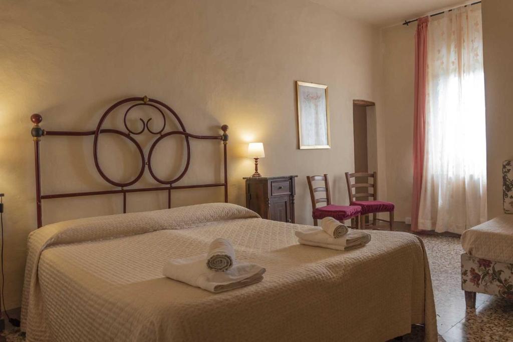 Postel nebo postele na pokoji v ubytování Agriturismo La Ripolina