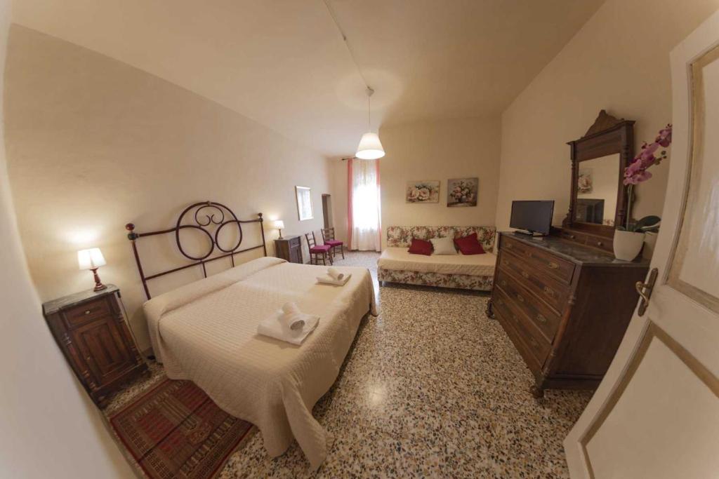 Postel nebo postele na pokoji v ubytování Agriturismo La Ripolina