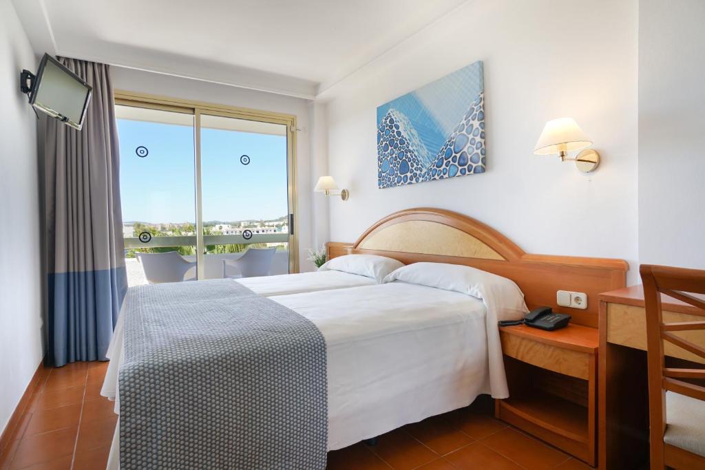 Postel nebo postele na pokoji v ubytování Hotel Millor Sol