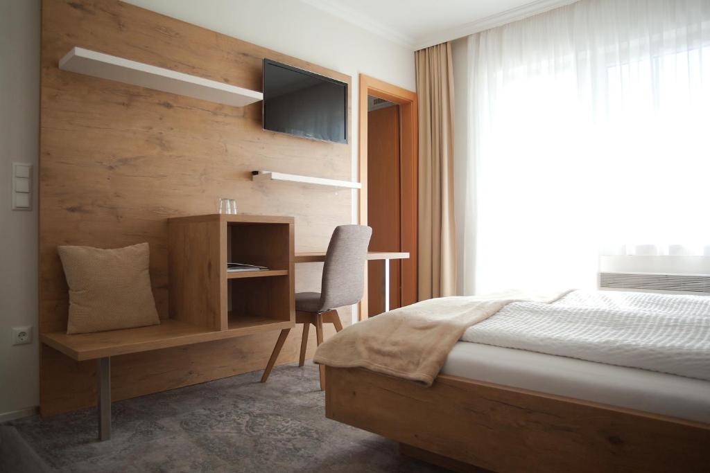 Postel nebo postele na pokoji v ubytování Haus Renée