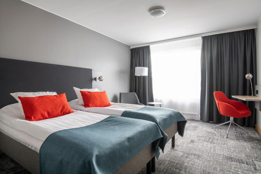 Postel nebo postele na pokoji v ubytování Quality Hotel Prisma