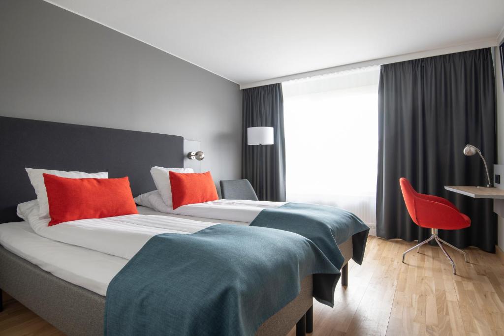 Postel nebo postele na pokoji v ubytování Quality Hotel Prisma