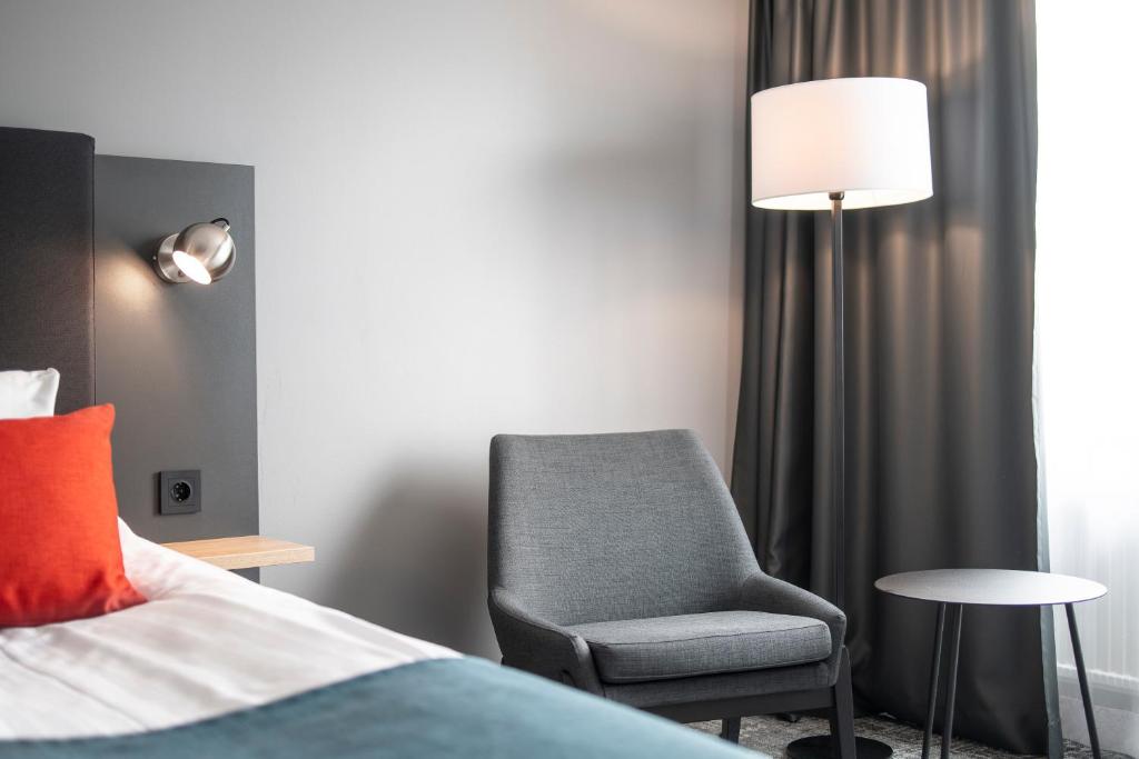 Postel nebo postele na pokoji v ubytování Quality Hotel Prisma