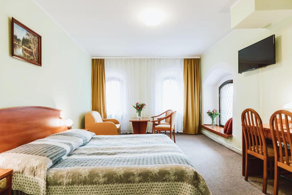 Postel nebo postele na pokoji v ubytování Hotel Gromada Toruń