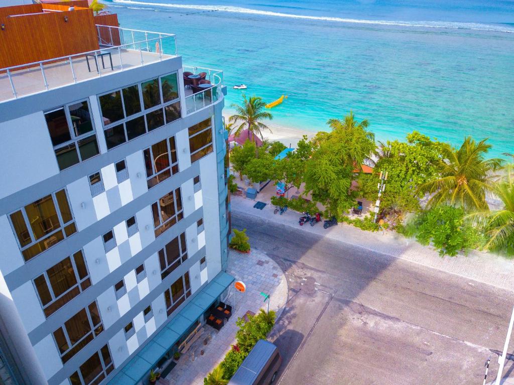 an aerial view of a building and the ocean at Paralian Hulhumale' in Hulhumale