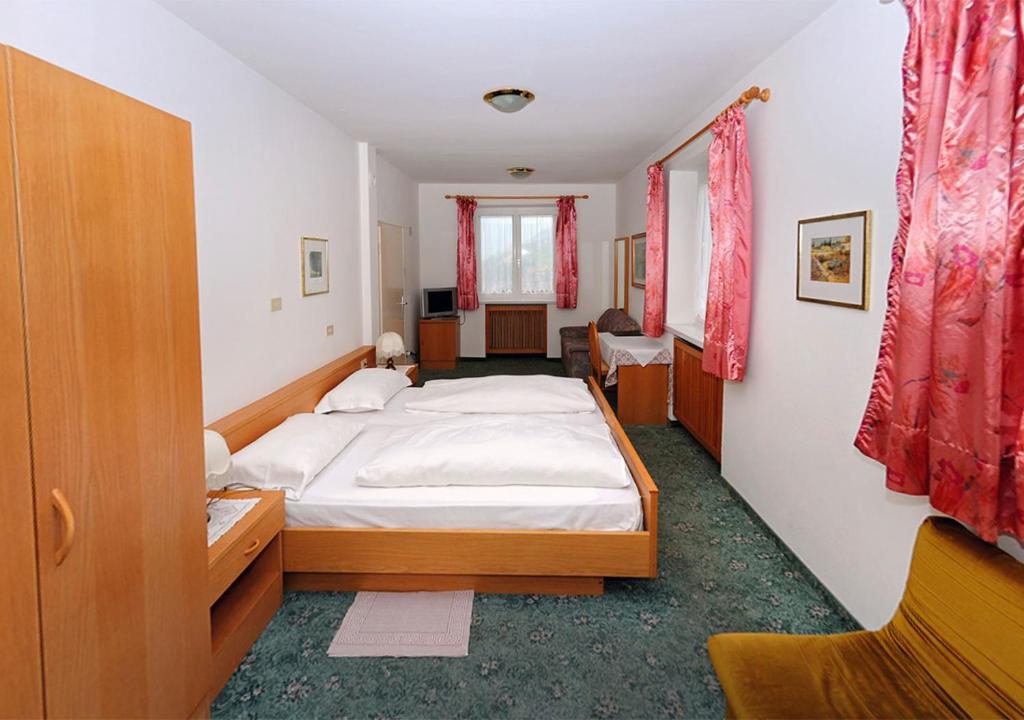 Postel nebo postele na pokoji v ubytování Pension Planta