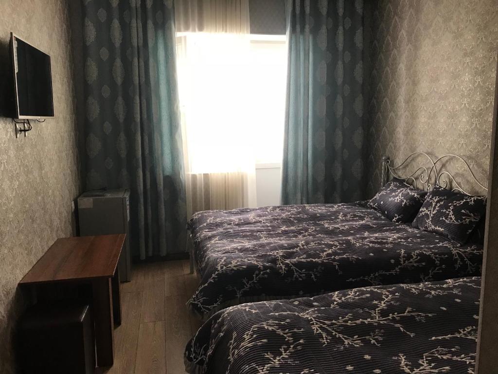 Postel nebo postele na pokoji v ubytování Asem Guest House