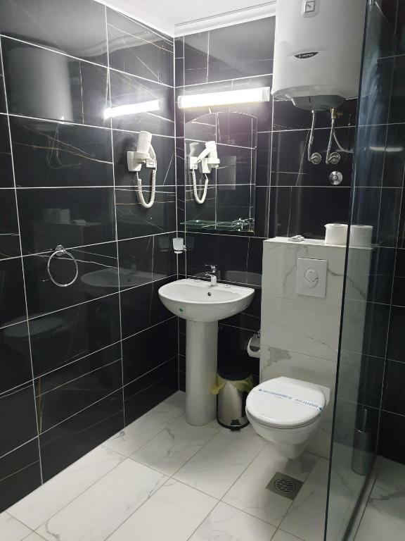 Koupelna v ubytování Hotel Cingo