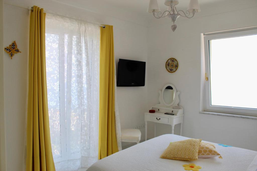 Postel nebo postele na pokoji v ubytování Guest House Malù