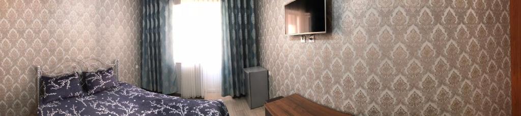 Postel nebo postele na pokoji v ubytování Asem Guest House
