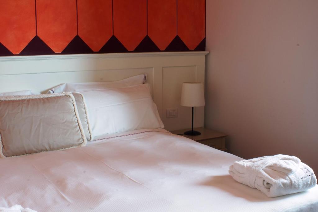 Postel nebo postele na pokoji v ubytování Saturnia Tuscany Hotel