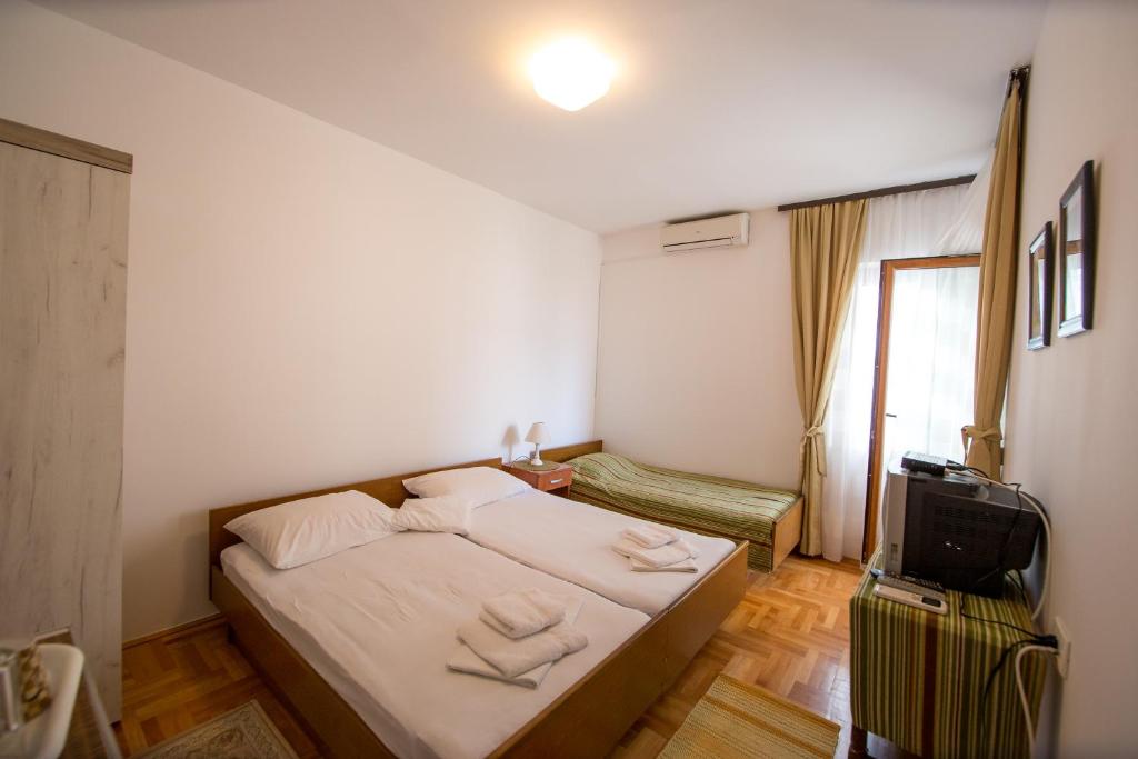 Ένα ή περισσότερα κρεβάτια σε δωμάτιο στο Guesthouse Dapcevic