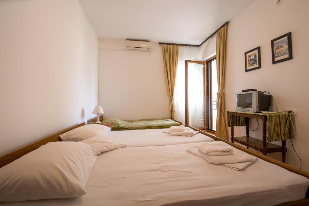 Ένα ή περισσότερα κρεβάτια σε δωμάτιο στο Guesthouse Dapcevic