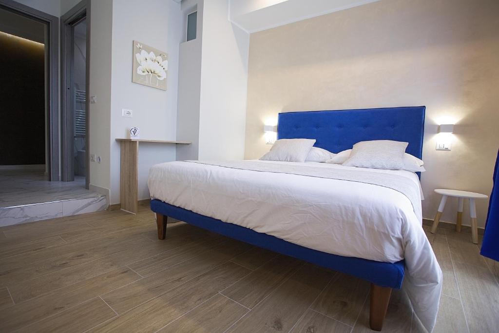 Łóżko lub łóżka w pokoju w obiekcie PVrooms