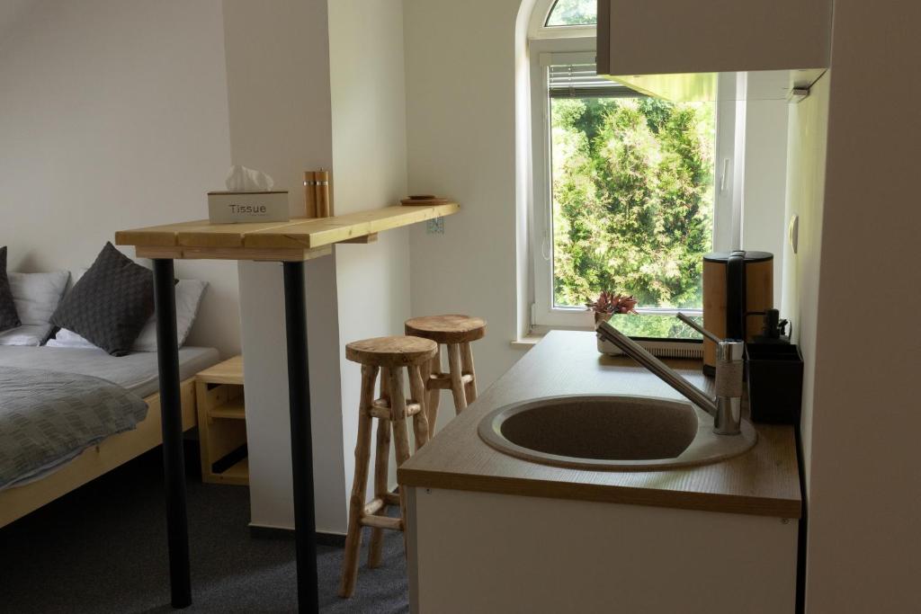 Posteľ alebo postele v izbe v ubytovaní Treehouse Apartments