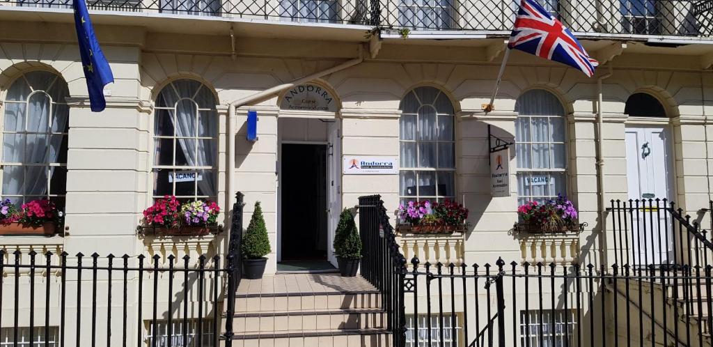 a building with a flag in front of it at Andorra Guest Accommodation in Brighton & Hove