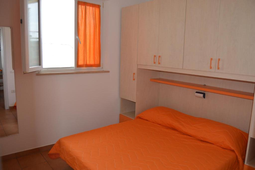 Postel nebo postele na pokoji v ubytování CAMPING TRE ARCHI