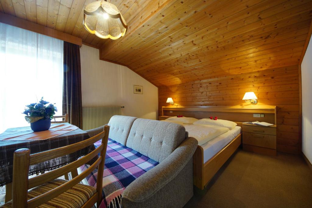Postel nebo postele na pokoji v ubytování Garni Flurida