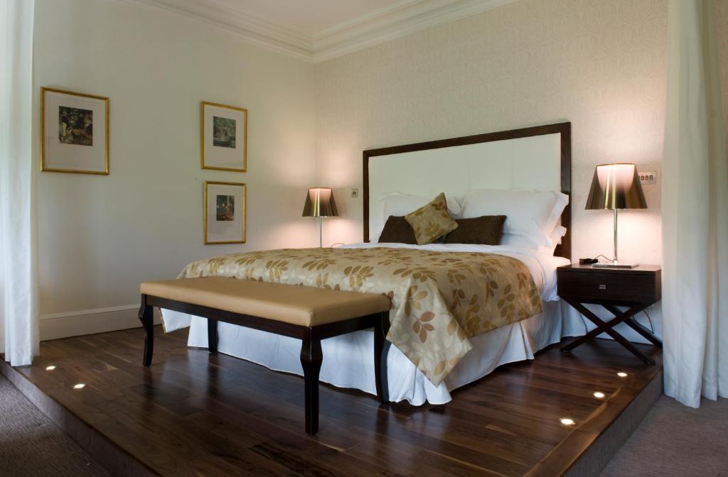 a bedroom with a large bed and two lamps at 21212 in Edinburgh