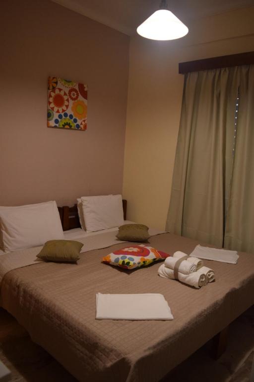 Postel nebo postele na pokoji v ubytování GIOTA ROOMS