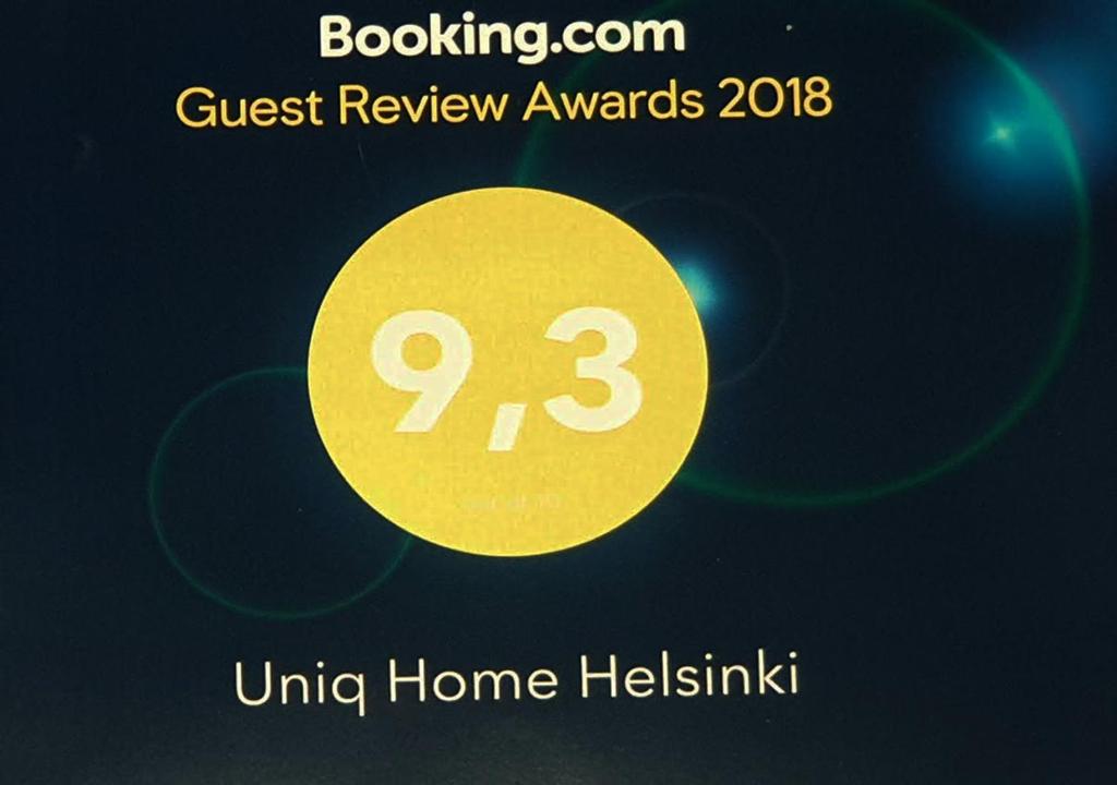 a yellow circle with the words guest review awards under home heitzisk at Uniq Home Helsinki in Helsinki