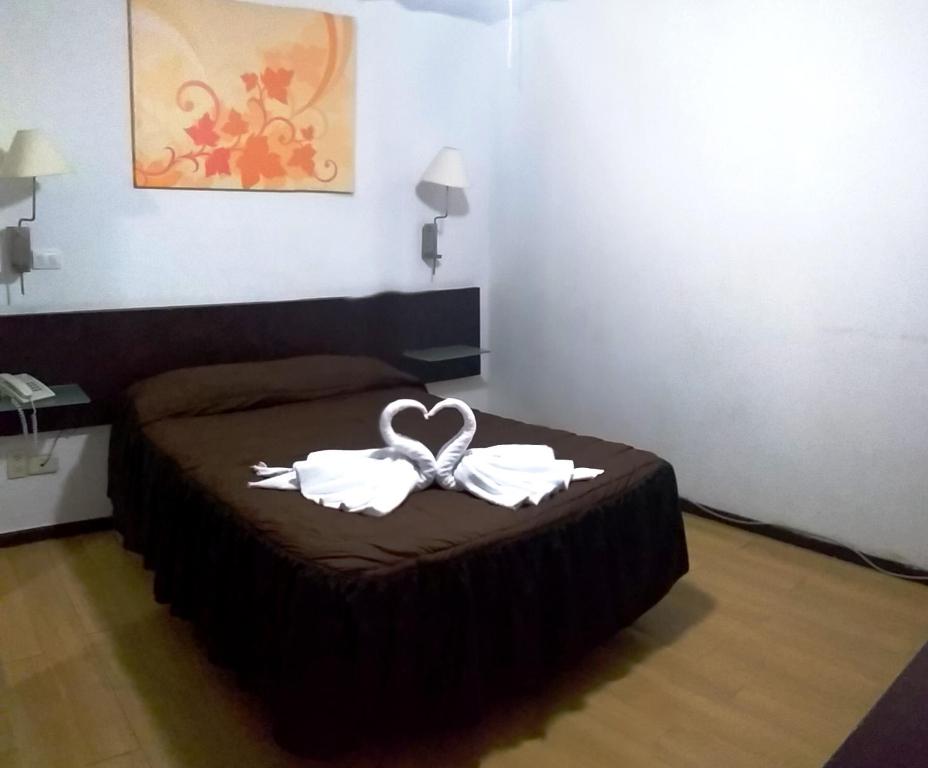 Postel nebo postele na pokoji v ubytování Hotel Trevi