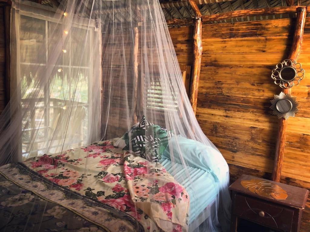 Ein Bett oder Betten in einem Zimmer der Unterkunft GuaiGüí Bayahibe