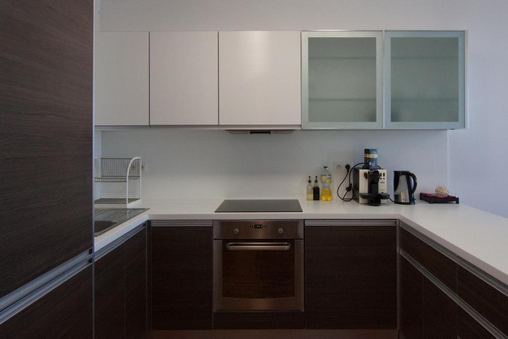A kitchen or kitchenette at Juls Apartment next to football and hockey stadium