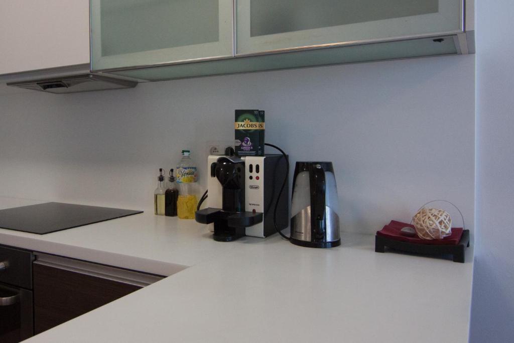 A kitchen or kitchenette at Juls Apartment next to football and hockey stadium