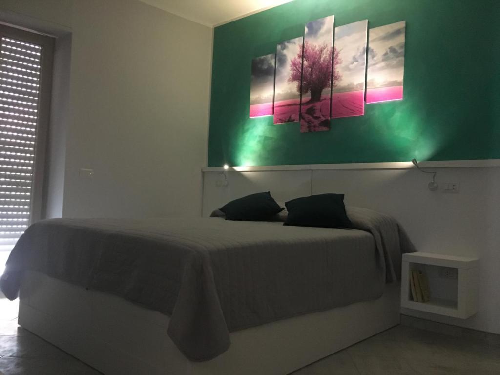 Posteľ alebo postele v izbe v ubytovaní B&B La Pigna
