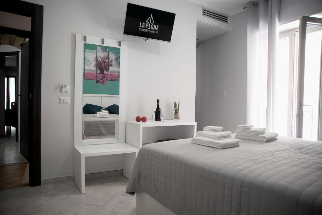 Posteľ alebo postele v izbe v ubytovaní B&B La Pigna