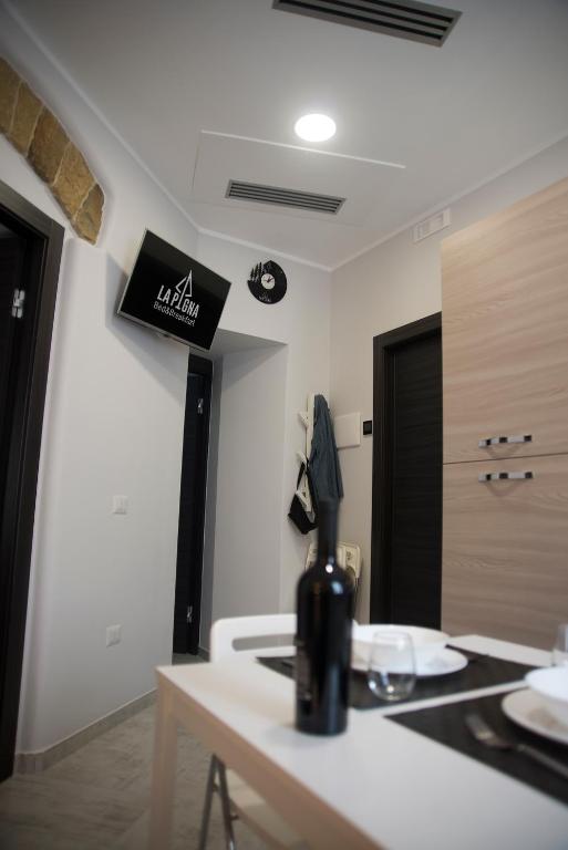 Televízia a/alebo spoločenská miestnosť v ubytovaní B&B La Pigna