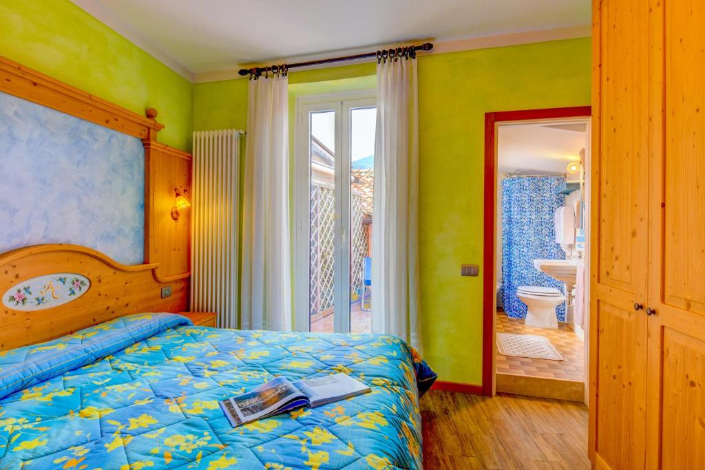 Postel nebo postele na pokoji v ubytování Hotel Castello