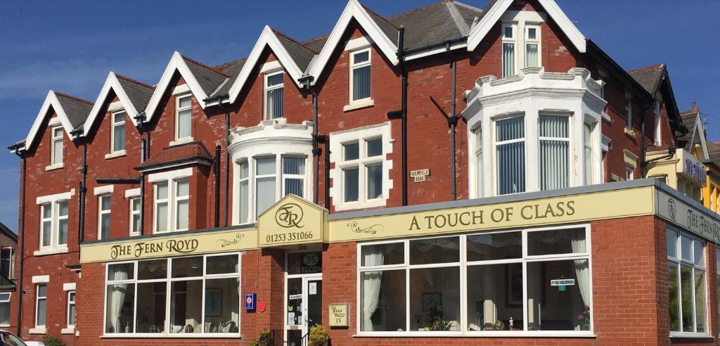 a brick building with a hotel of glass at The Fernroyd in Blackpool