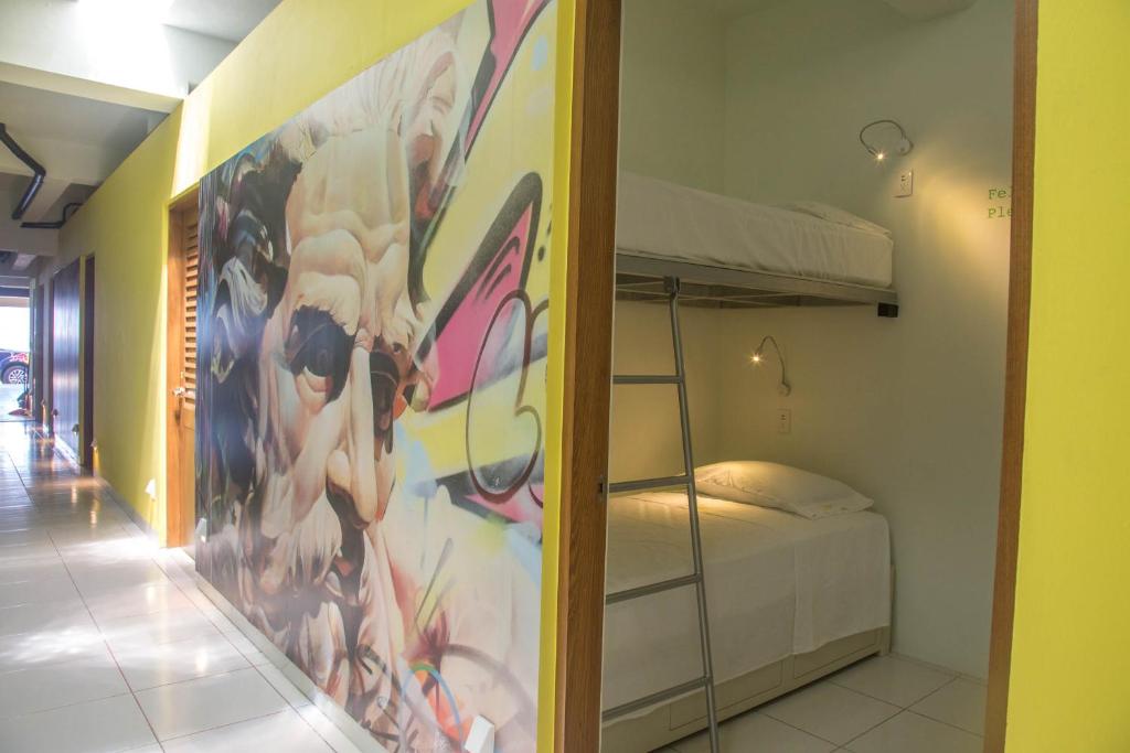 Postel nebo postele na pokoji v ubytování Hostel Frente al Mar Tropico 20º