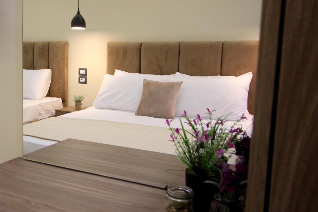 Postel nebo postele na pokoji v ubytování Hotel Sunway