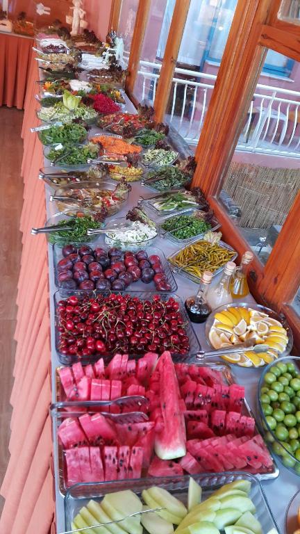 a buffet of different types of fruits and vegetables at Grand Yayla Hotel in Çeşme