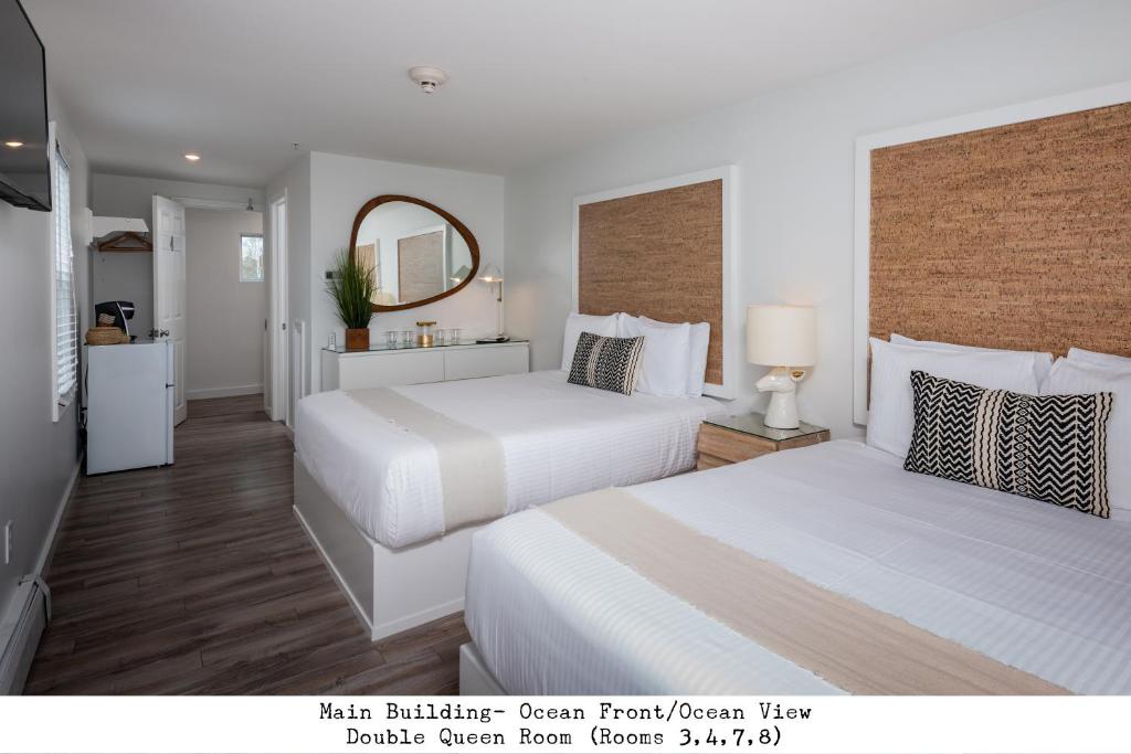 a hotel room with two beds and a mirror at Stones Throw in York Beach