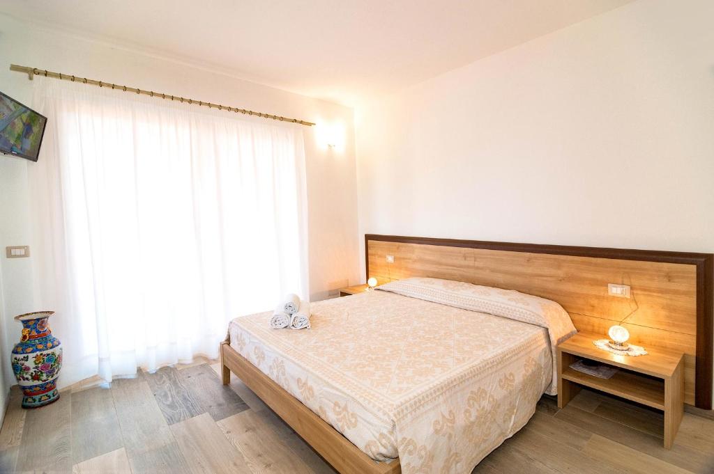 Łóżko lub łóżka w pokoju w obiekcie MOLAROTTO CAMERE CON ANGOLO COTTURA