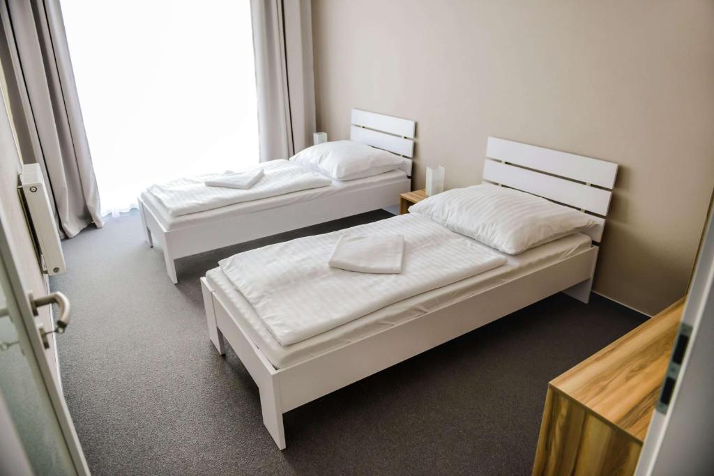 Postel nebo postele na pokoji v ubytování Penzión Fonte