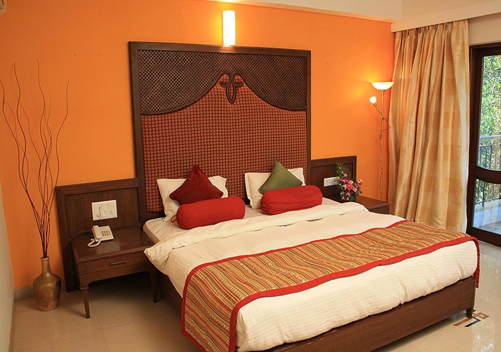 Postel nebo postele na pokoji v ubytování Tangerine Boutique Resort