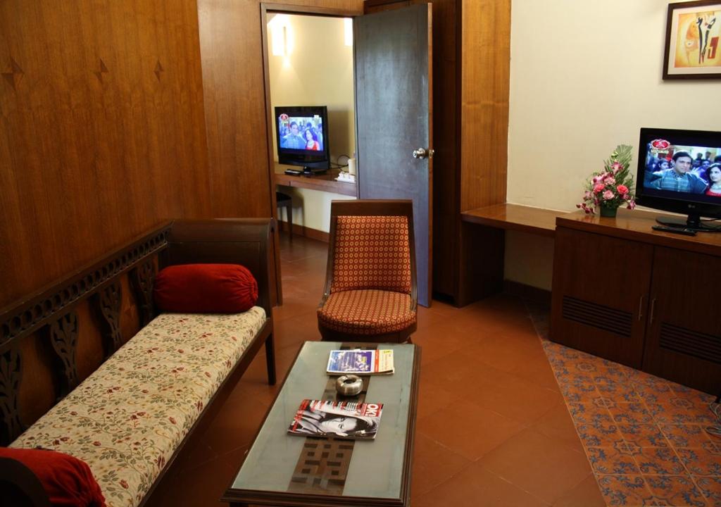 TV a/nebo společenská místnost v ubytování Tangerine Boutique Resort