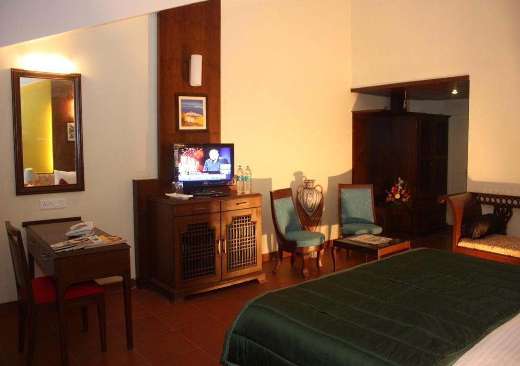TV a/nebo společenská místnost v ubytování Tangerine Boutique Resort