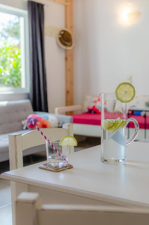 A bed or beds in a room at Happiness Apartments