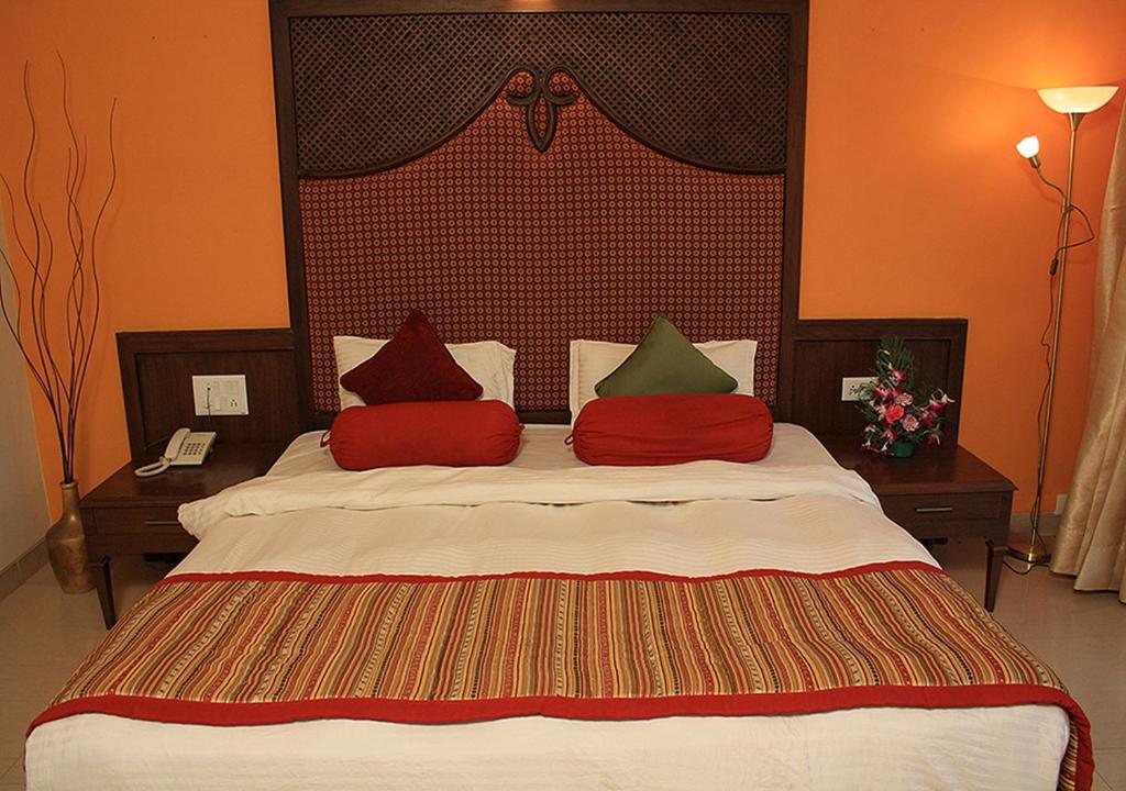 Postel nebo postele na pokoji v ubytování Tangerine Boutique Resort