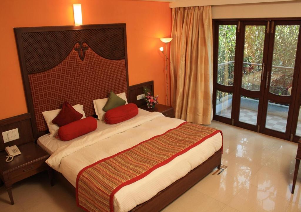 Postel nebo postele na pokoji v ubytování Tangerine Boutique Resort