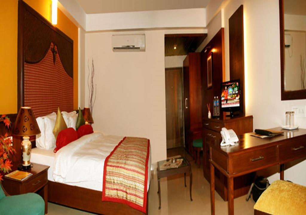 Postel nebo postele na pokoji v ubytování Tangerine Boutique Resort