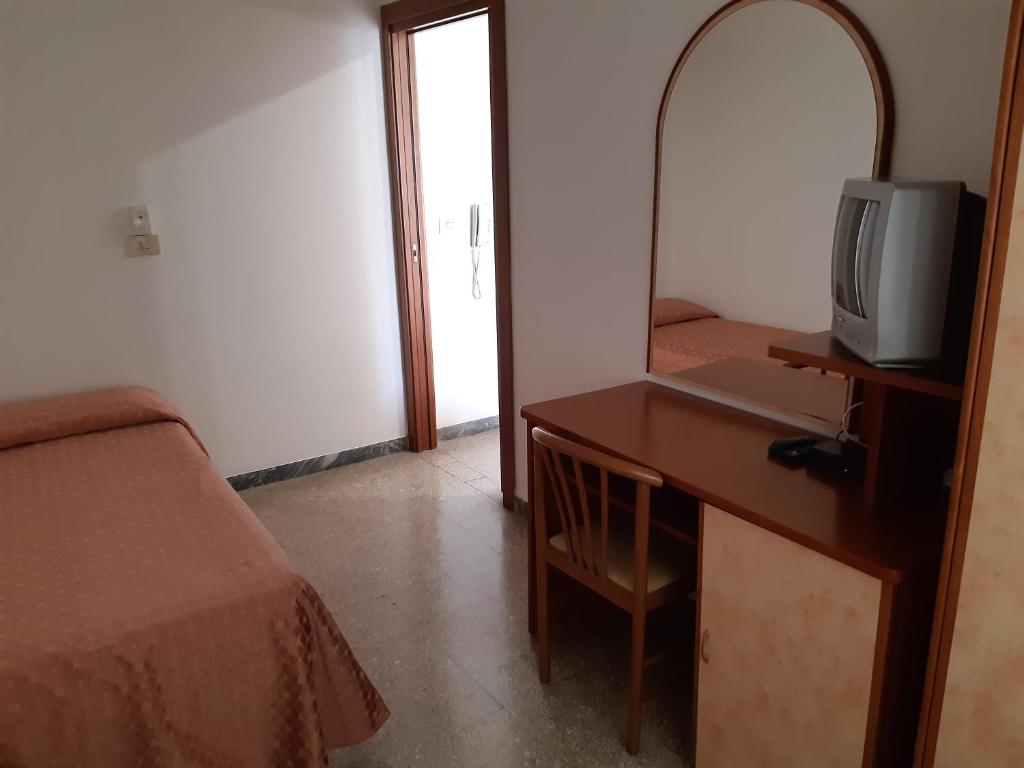 Postel nebo postele na pokoji v ubytování Hotel Rosa