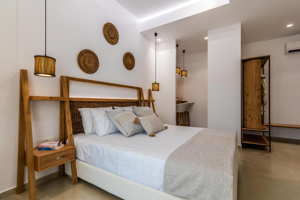 Postel nebo postele na pokoji v ubytování Terra Oliva Milos