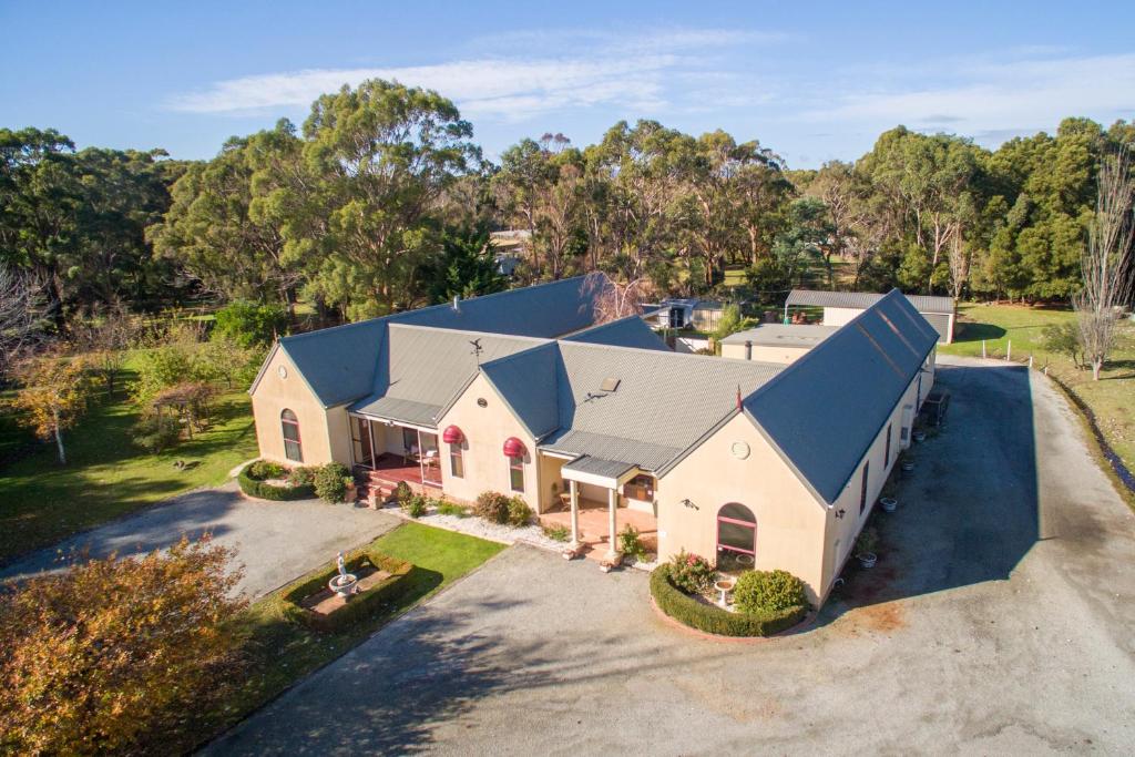 an aerial view of a house with a blue roof at Tranquilles Bed & Breakfast in Port Sorell
